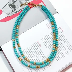 Making Joy Small Beaded Two Strand Necklace with Gold Tone Spacers in Sky Blue