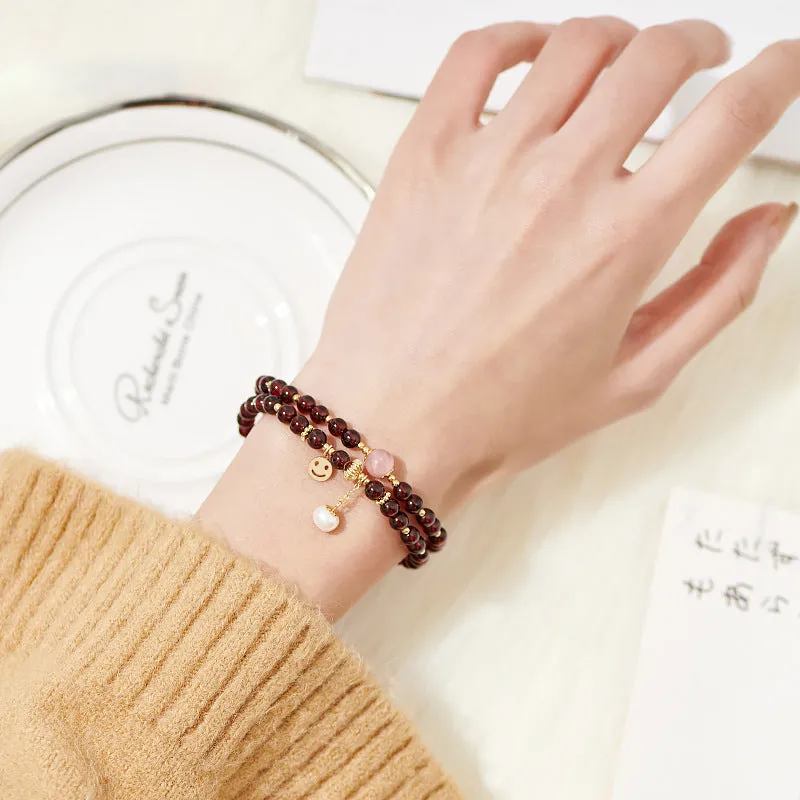 Smiling Face Pink Crystal and Pearl Bracelet with Garnet Double Ring Detail