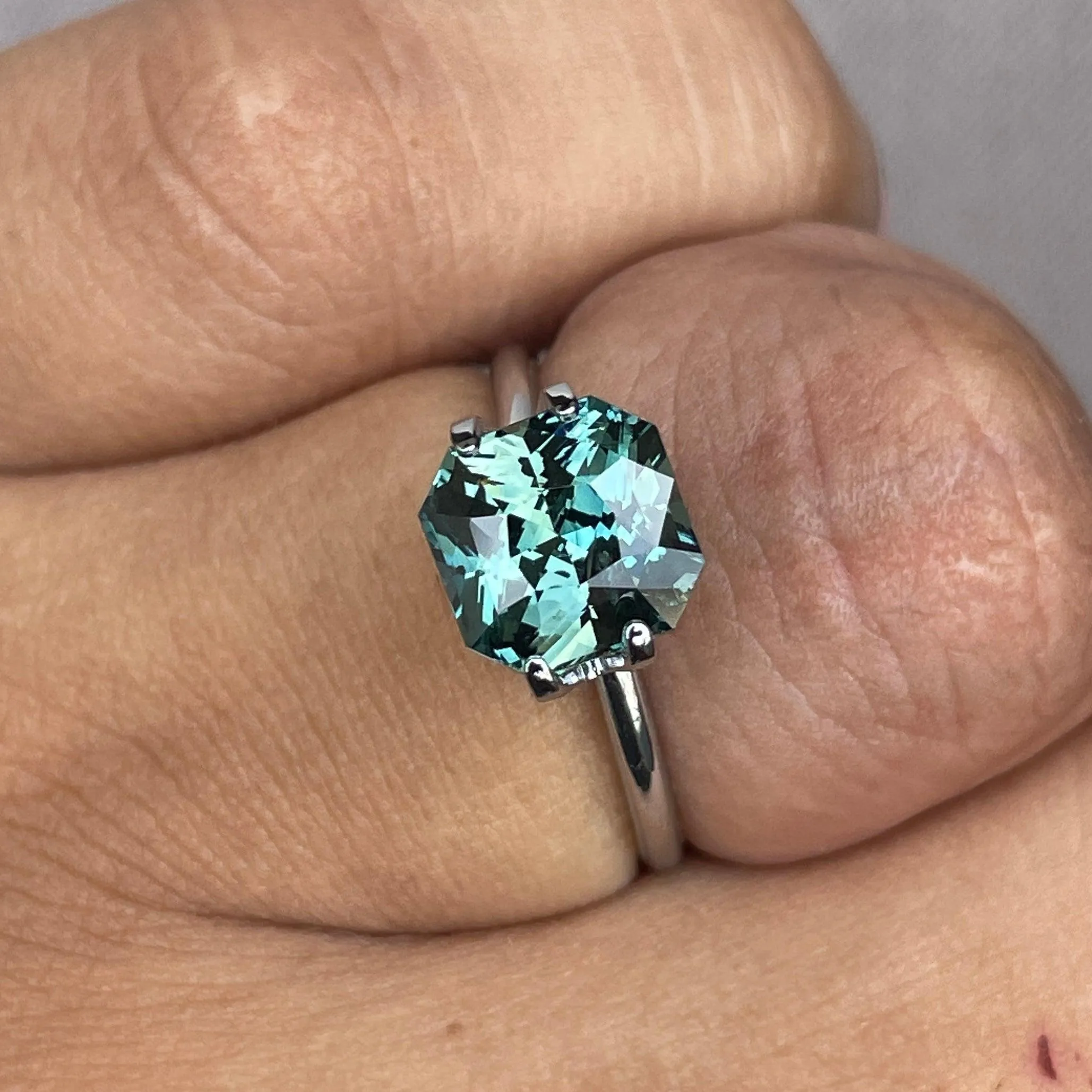 This 3.35 carat Teal Sapphire is well cut to bring out the best colour and luster, 8.20mm x 8.30mm x 5.50mm