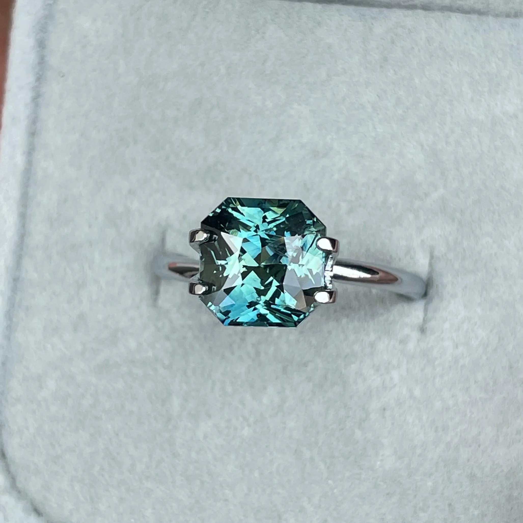 This 3.35 carat Teal Sapphire is well cut to bring out the best colour and luster, 8.20mm x 8.30mm x 5.50mm